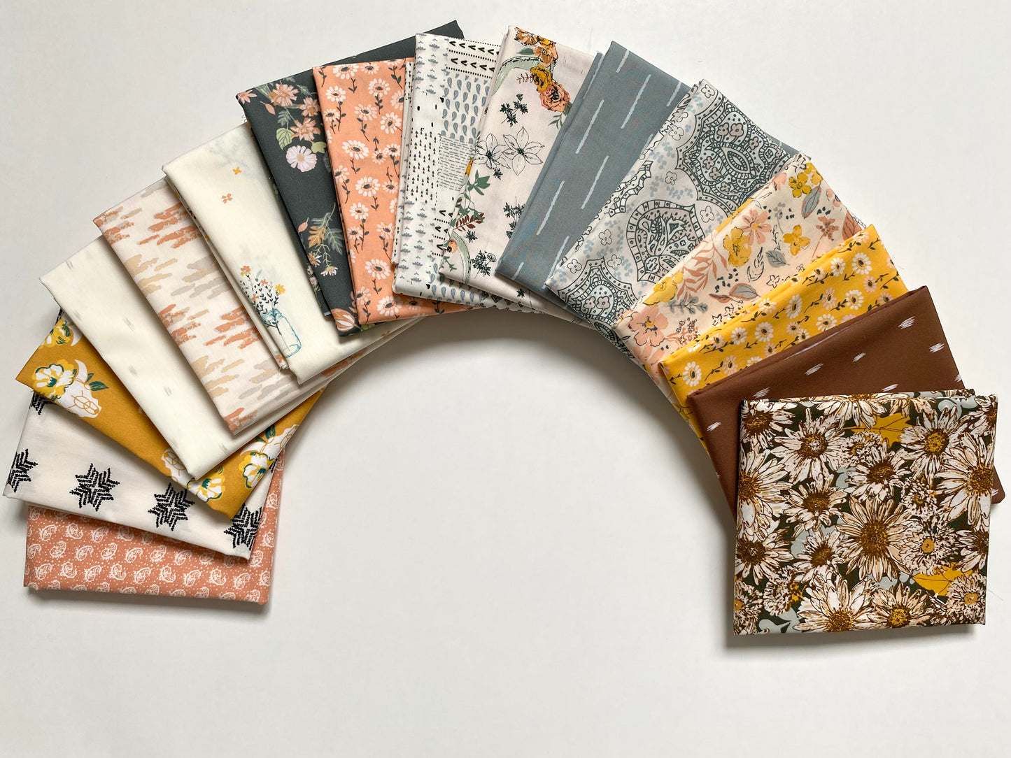 A cotton fabric bundle in fat quarter pieces from the Shine On collection the Art Gallery Fabrics, sold by Dolly Lou Fabrics