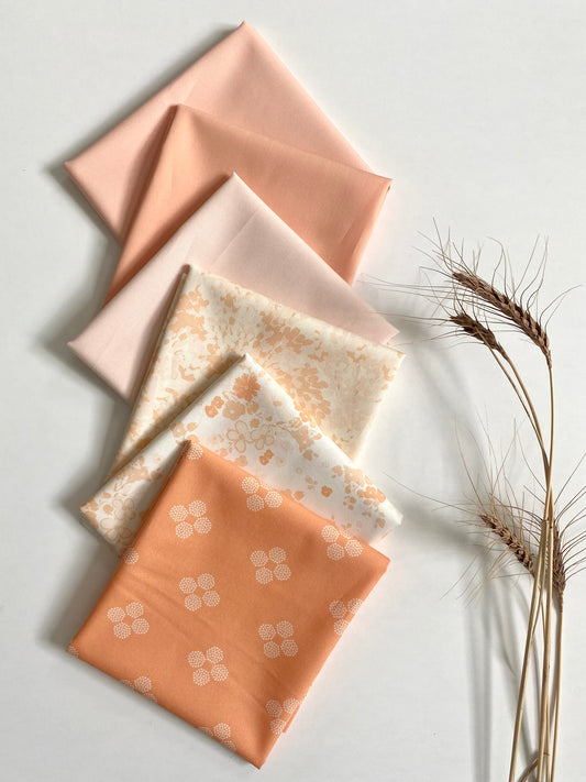 Fabric bundle sold by Dolly Lou Fabrics, Contains Art Gallery Fabrics Nectarine Fusion and Pure Solids