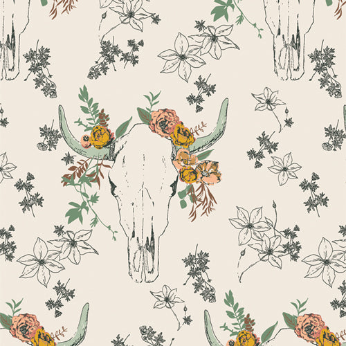 Fabric patterned with bull skulls and flowers in cream and green, sold by Dolly Lou Fabrics