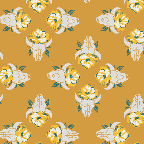 Fabric used for quilting sold by Dolly Lou Fabrics. Patterned with bull skulls and flowers in yellow and green.
