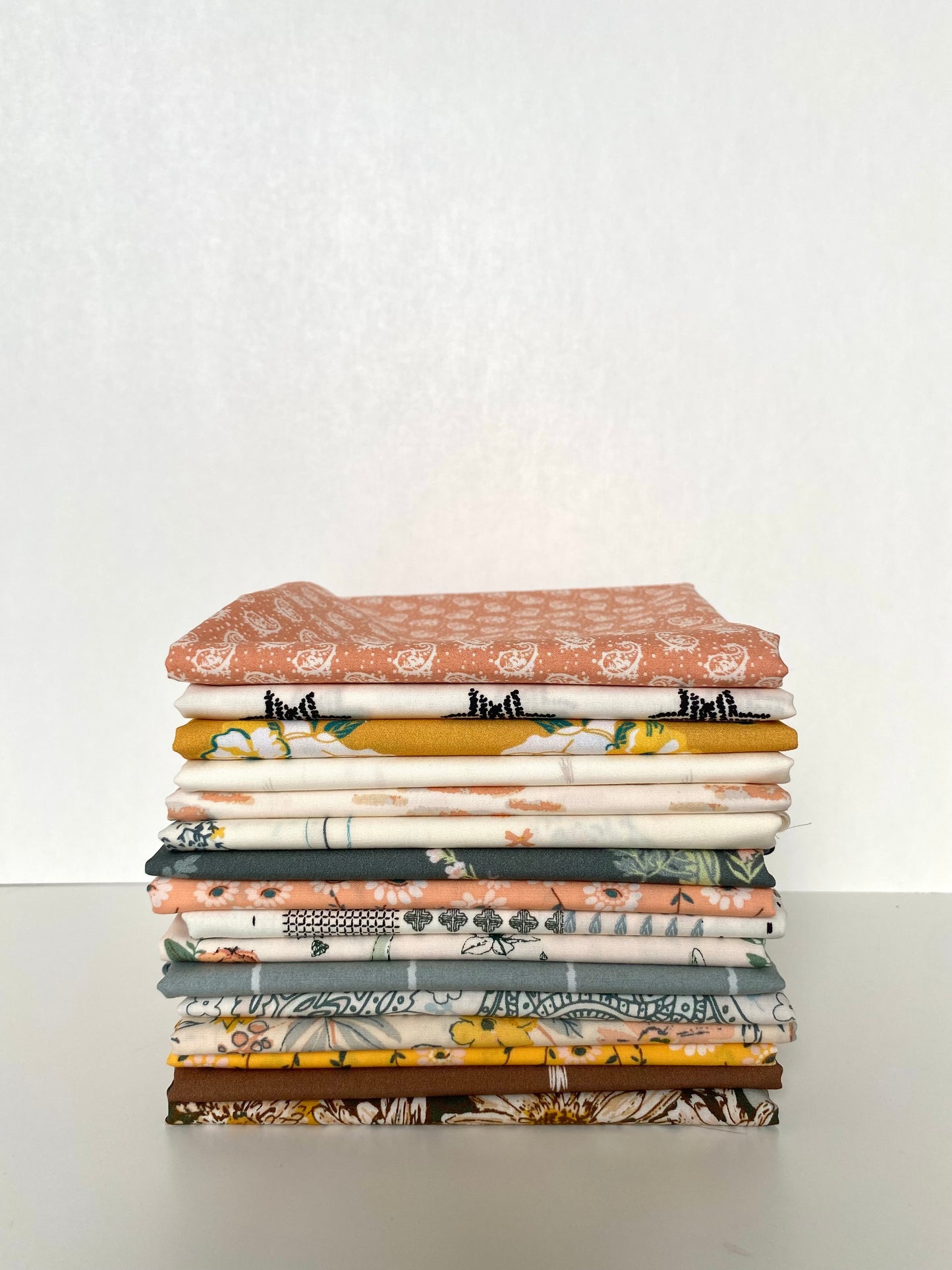 A cotton fabric bundle in fat quarter pieces from the Shine On collection the Art Gallery Fabrics, sold by Dolly Lou Fabrics